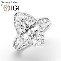 a diamond engagement ring with two pear shaped diamonds on the band and an oval cut center stone