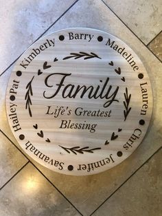 a wooden sign that says family life's greatest blessing on the side of a tile floor