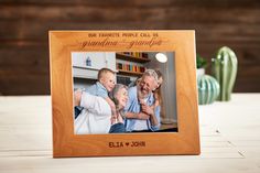 a wooden frame with an image of two adults and one child