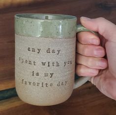 a person holding a coffee mug that says any day i can't with you is my favorite day