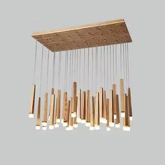 a wooden chandelier hanging from the ceiling with several lights on each one side