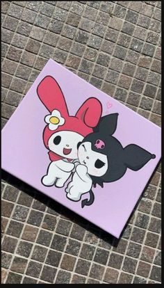 a pink square with an image of two cartoon characters hugging each other on the ground