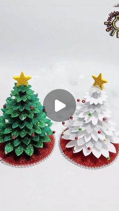 two small christmas trees sitting on top of each other