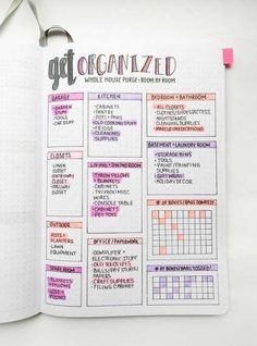 an open planner with the words get organized written in pink and purple on it next to a pair of scissors