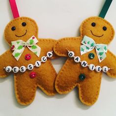 Personalised Gingerbread Man decoration Handmade with a ribbon bow, buttons and name of your choice in beads across the front - coordinated hanging ribbon Ribbon choices: green snowflake - red snowflake - gold gingerbread - blue polar bears - red Xmas hats PLEASE ADD NAME AND RIBBON CHOICE TO ORDER AT CHECKOUT Gingerbread Man measures approximately 3 inches high (excluding ribbon) Felt Gingerbread Man, Gingerbread Man Decorations, Felt Gingerbread, Diy Felt Christmas Ornaments, Name Decorations, Gingerbread Crafts, Gingerbread Christmas Decor, Felt Crafts Christmas, Gingerbread Decorations