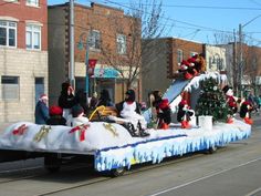 the float is decorated with penguins and snowmen