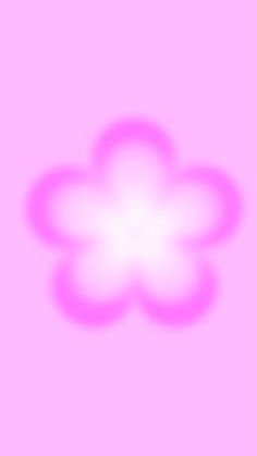 a blurry image of a flower on a pink background