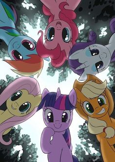 many different colored ponys are standing in a circle with their eyes open and looking up