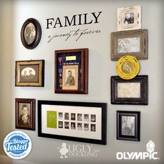 a wall with many framed photos and family pictures on it's side, along with a plaque