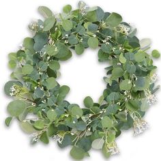 a wreath with green leaves and white flowers