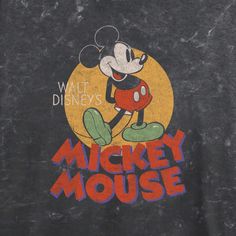 the mickey mouse shirt is black with red and yellow letters