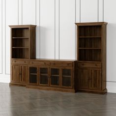 a wooden entertainment center sitting on top of a hard wood floor next to a white wall