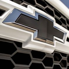 the front end of a chevrolet vehicle with its grille grills and logo on it