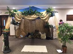 an indoor area decorated with plants and decorations