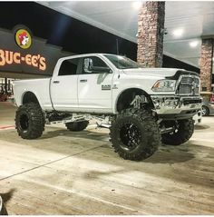 a large white truck parked in front of a buc - ee's store