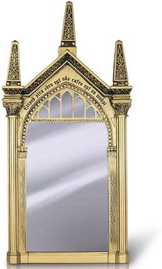 an ornate gold mirror is shown against a white background