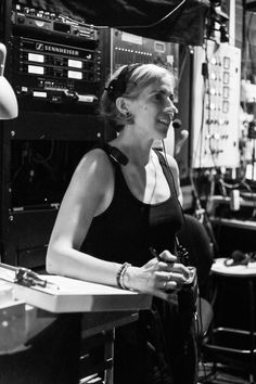 black and white photograph of woman in radio studio