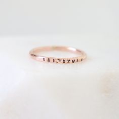 A subtle and beautiful reminder of your favorite date in Roman numerals. Our pebbled 1.63 mm band is hand formed, soldered, hammered and stamped with your special date. This listing is for one ring; add multiple quantities to your cart for more. This ring is substantial standing alone, yet minimalist enough to stack several. There are online date converters to easily convert / check your date. Please message us if you need assistance confirming a date format. {IDEAS}: wedding date, birth date, g Date Ring, Wedding Bands For Her, Gold Makeup, Letter Ring, Birthday Ring, Initial Ring, Roman Numeral, Personalized Rings, Stackable Ring