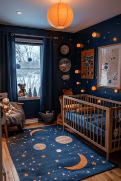 a baby's room with blue walls and stars on the ceiling, crib