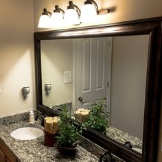 a bathroom sink with a large mirror above it