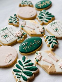 decorated cookies are arranged on a table