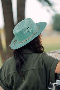 The new Topo Chico Charlie 1 Horse hat is an extremely fun way to finish off any spring or summer outfit. The light weight straw, ventilated crown and cushioned sweatband will aid in all day comfort while your at the beach or rodeo! 4" Teardrop crown3" Flat brimGrey braided leather hatband with silver toned accent studsThunderbird pattern side ventsHand Branded "C" on crown (Will Vary) Green Western Hats For Spring, Adjustable Green Fedora For Spring, Green Western Style Hats For Spring, Upf 50+ Hat Band For Spring Outdoor, Upf 50+ Hat Bands For Spring Outdoor, Green Summer Hat For Rodeo, Casual Toquilla Straw Panama Hat For Festivals, Green Western Fedora For Summer, Green Western Hat Bands For Summer