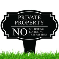 a private property sign in the grass