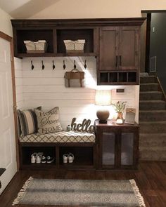 the entryway is decorated in white and brown