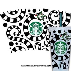 the starbucks cup is decorated with black and white designs