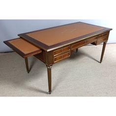 an antique desk with two drawers on each side