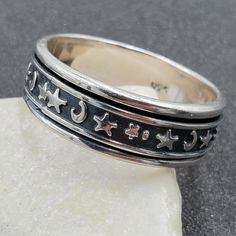 Wonderful, Estate 925 Sterling Silver Celestial Moon and Stars Mens Spinner / Fidget Ring. This amazing ring is sure to receive many compliments! SOLID925 STERLING SILVER, FULLY TESTED, NOT PLATED OR FILLED. Ring Size: 13.75 Width: 8 mm Weight: 8.6 Grams Hallmarked: 925 We gladly combine shipping! Everything is packed with care to make sure it arrives safely. We only sell authentic items. If it is a name brand item, we guarantee it to be authentic. If it is made of precious metals and or gemston Fidget Rings, Spinner Ring, Spinner Rings, Moon And Stars, Moon Stars, Perfect Christmas Gifts, Silver Band, Precious Metals, Beautiful Rings