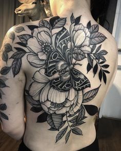 the back of a woman's body with flowers on it and an instagram