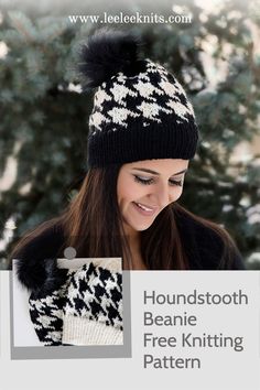 a woman wearing a black and white knitted hat with pom - pom