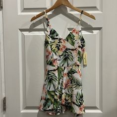 Super Cute Tropical Print Romper. The Picture Doesn’t Do It Justice. This Romper Looks Like A Skirt In The Front Because Of The Layered Fabric. White Printed Jumpsuits And Rompers For Beach, White Floral Print Jumpsuits And Rompers For Vacation, White Printed Jumpsuits And Rompers For Vacation, White Floral Print Jumpsuit For Vacation, White Printed V-neck Jumpsuits And Rompers, Printed White Jumpsuits And Rompers For Day Out, Heart Pants, Tropical Romper, Layered Fabric