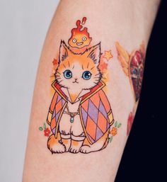 an orange and white cat with a crown on it's head is sitting down