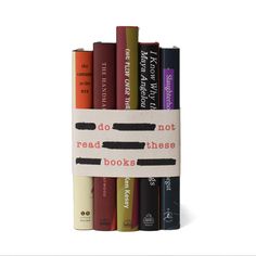 a stack of books sitting on top of each other in front of a white background