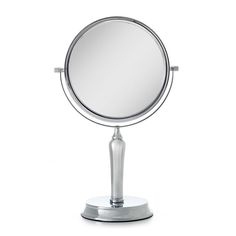 a round mirror sitting on top of a metal stand in front of a white background