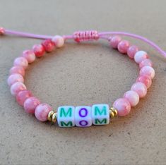 Mom Beaded Adjustable Bracelet. Gemstone: Pink Persian Jade Stone 6mm. Size: 6 Inches When Fully Closed And 10.5 Inches When Fully Open. It's Made Adjustable So It Will Fit You Just Perfectly. Great Gift For Mom, Friends, Wife, Sister Or Any Lady In Your Life. Adjustable Pink Beaded Bracelets With 8mm Beads, Pink Friendship Bracelets With 8mm Round Beads, Adjustable Letter Beads For Jewelry Making, Adjustable Colorful Beaded Friendship Bracelets For Mother's Day, Hand-strung Round Beads Bracelets For Mother's Day, Hand-strung Beaded Bracelets For Mother's Day, Hand-strung Bracelets For Mother's Day, Luxury Hand-strung Beaded Bracelets For Mother's Day, Mother's Day Hand-strung Round Bead Bracelets