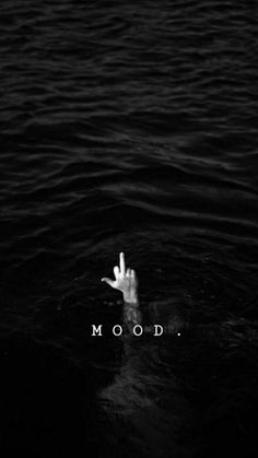 a hand reaching out from the water with the word mood on it's side