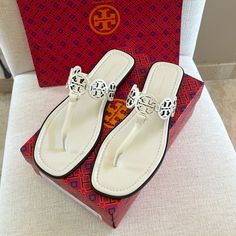 Tory Burch Tiny Miller Sandals In Ivory. Calf Leather With Leather Soles. Beautiful Elegant Sandals. Size 8. Have In Black Also On My Site. New With All Original Packaging. I Prefer These To The Original Miller’s, When Wanting To Elevate Your Look. Luxury White Sandals With Single Toe Strap, White Classic Sandals With Single Toe Strap, Classic White Sandals With Single Toe Strap, Classic White Sandals With Flat Heel, Classic White Flat Sandals, White Sandals With Branded Heel Counter, White Flat Heel Sandals With Branded Heel Counter, Luxury Cream Almond Toe Sandals, Chic White Sandals With Almond Toe