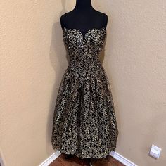 80s Vtg Vintage Gunne Sax By Jessica Mcclintock Gunne Sax Black & Gold Prom Formal Cocktail Dress Brand: Jessica Mcclintock Gunne Sax Condition: Guc Size: Size: 11/12 *See Measurements Below* Labeled Size 11/12 But Fits Like An 8/10. Please See Measurements. Measurements: Flat Lay, In Inches, Approx Bust: 17.5" Waist: 16" Length: 49" Gold Lace Overlay On The Princess, Tulle Skirt. Skirt Is A Mid Shin Length Sweetheart Neckline With Two Thin Straps Full Tulle Lined & Zips In Back Rayon / Acetate Smoke And Pet Free Home Quick Shipping Bundle And Save On Shipping Gold Prom, Formal Cocktail Dress, Jessica Mcclintock, Prom Formal, Gunne Sax, Gold Lace, Skirt Skirt, The Princess, Lace Overlay