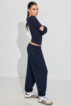 Navy Loungewear Pants, Navy Athleisure Pants For Loungewear, Relaxed Sweatpants With Ribbed Cuffs, Wide-leg Loungewear Bottoms With Elastic Cuffs, Solid Color Sweatpants For Relaxation, Solid Sweatpants For Relaxation, Relaxed Fit Sweats For Fall, Navy Relaxed Fit Pants For Loungewear, Relaxation Solid Sweatpants