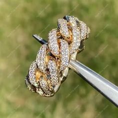 a diamond ring on top of a metal pole