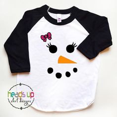 "Snowman Shirt. This adorable \"Snowman\" shirt is perfect for your little one. Could be used as a cute everyday shirt or for a holiday! It also makes a great gift! It is made using high quality heat transfer vinyl and comes on a white/black shirt. BOY VERSION Available as well as Other Designs! (Please see my other listings) https://www.etsy.com/shop/Headsupshirtdesigns?ref=seller-platform-mcnav&section_id=18569243 **SIZING** We use the American Apparel brand shirts. These shirts tend to ru Snowman Tshirt, Girl Snowman, Portrait Silhouette, Hipster Gifts, Sublimacion Ideas, Snowman Shirt, Cricket Ideas, Holiday Clothes, Snowman Faces