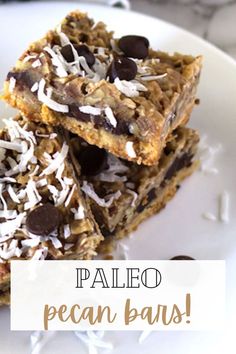 three pieces of pecan bars stacked on top of each other with chocolate chips and coconut