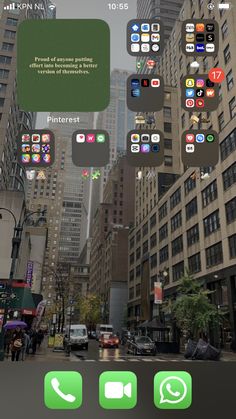 an image of a city street with lots of buildings and people walking on the sidewalk