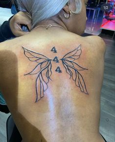 a woman with a tattoo on her back