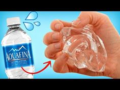 a hand holding a glass bottle with water in it and an arrow pointing to the bottom