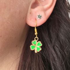 "Gold Shamrock earrings Four leaf clover jewelry Good Lucky clover jewelry  The four-leaf clover is an uncommon variation of the common, three-leaved clover. According to tradition, such leaves bring good luck to their finders. Each leaf is believed to represent something: the first is for faith, the second is for hope, the third is for love, and the fourth is for luck.A great gift idea for anyone you think might need some luck or a wish!  MEASUREMENTS: * Earrings 1 1/2\" (45mm) → MATERIALS: Gol Dainty Green Flower Earrings, Green Hypoallergenic Flower-shaped Earrings, Hypoallergenic Green Flower-shaped Earrings, Gift Green Single Flower Earring, Gift Single Green Flower Earring, Dainty Green Dangle Flower Earrings, Green Dainty Drop Flower Earrings, Dainty Green Drop Flower Earrings, Gold Jewelry For St. Patrick's Day Gift