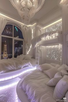 a bedroom with white bedding and lights on the ceiling is lit up at night